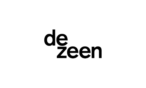 Logo of Dezeen with the word "dezeen" in lowercase black letters on a white background, embodying the understated elegance often found in luxury resorts like those of Auberge Resorts.