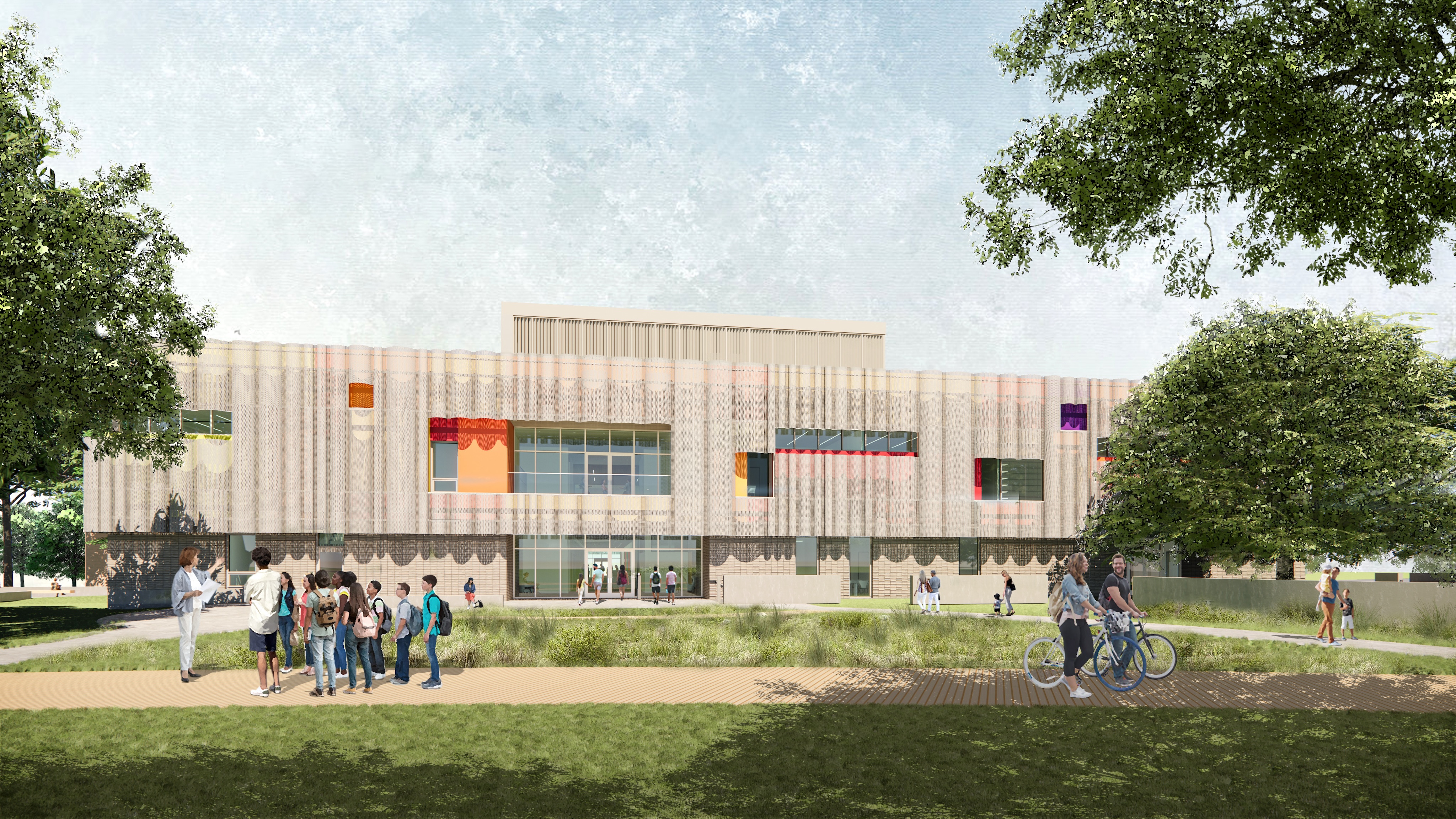 A modern building with large windows and colorful accents, the Dougherty Arts Center is surrounded by trees. In the foreground, a group of people gather while others ride bicycles on a nearby path, enjoying the vibrant atmosphere.