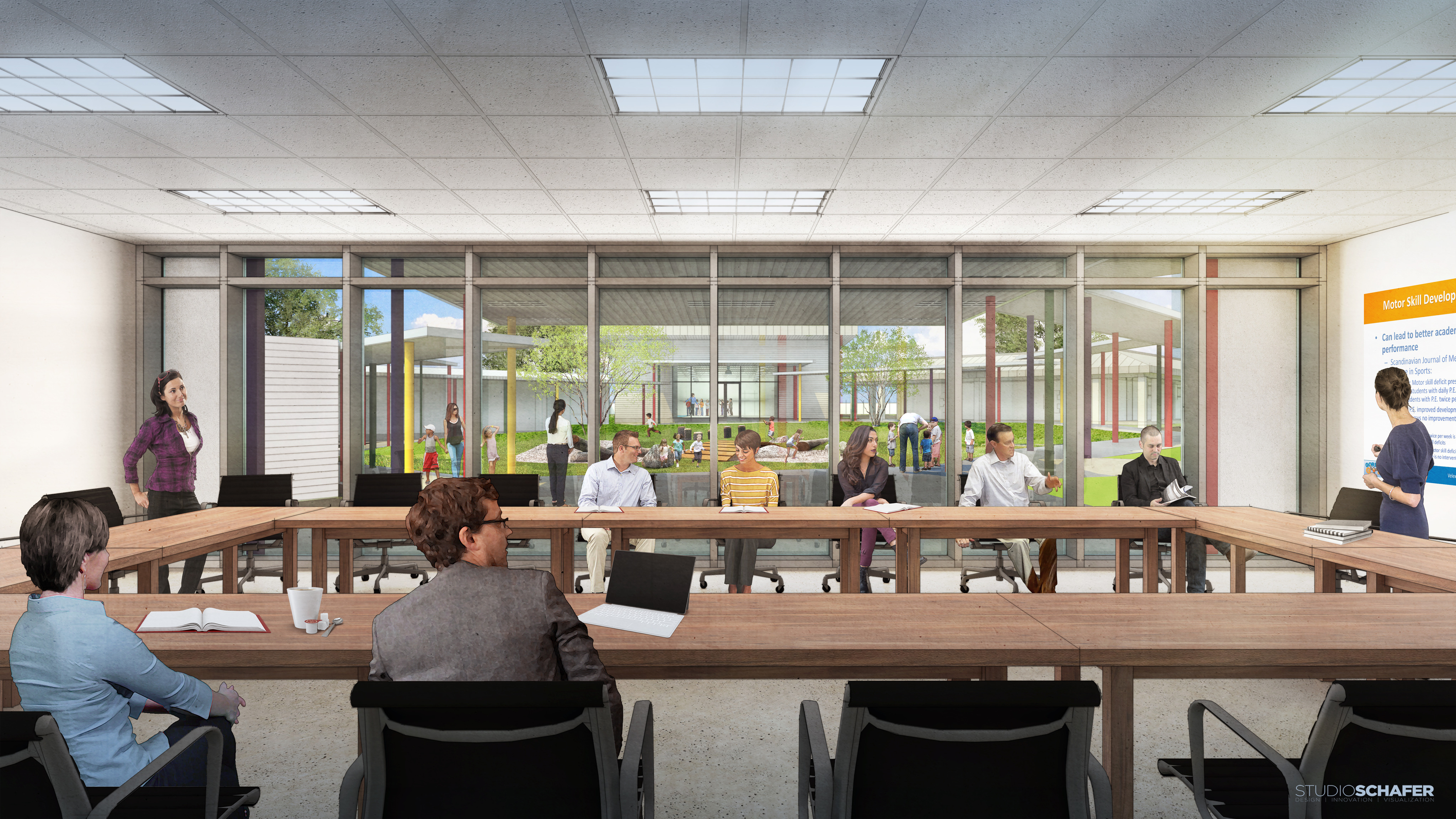 A group of people sit in a modern conference room with U-shaped tables, engaging in a meeting at the newly renovated Brighton Center, while a presentation is being delivered. Large windows in the background showcase the courtyard outside.