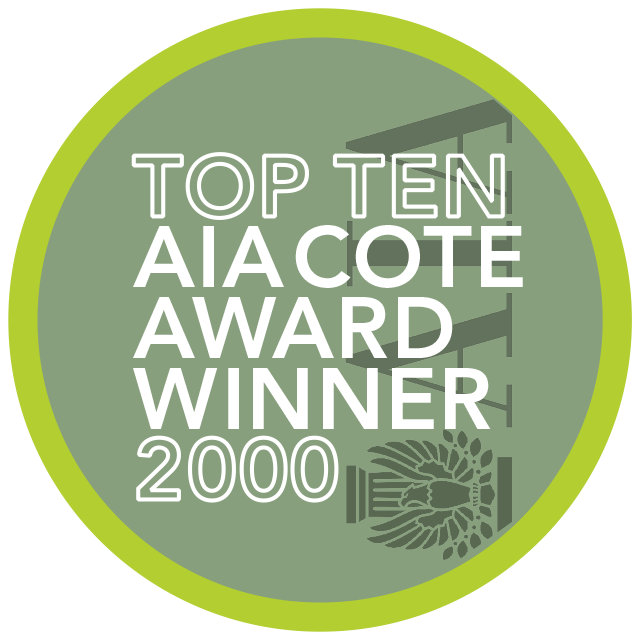 Circular badge with text reading "Top Ten AIA COTE Award Winner 2000" on a green background with a lime green border, inspired by the Lady Bird Johnson Wildflower Center.