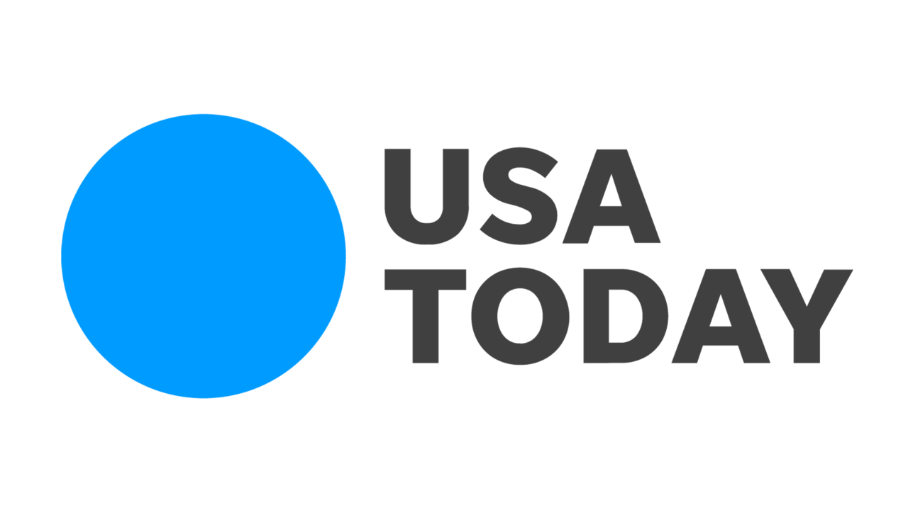 USA Today logo with a large blue circle on the left and the text "USA TODAY" in black on the right, reminiscent of the serene ambiance at Marie Selby Botanical Gardens.